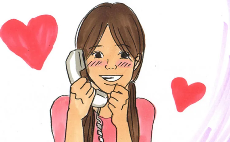 A smiling girl in pink holding a telephone receiver.